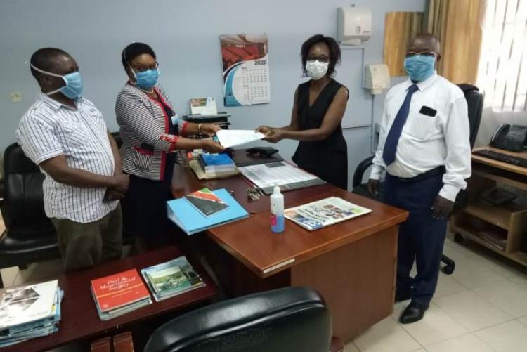 Handing over Ceremony to incoming CMO DR MUHIA by outgoing CMO Dr. Asimba witnessed by far left UHS Bursar Mr. Otiende and far right FoAdmin. Mr. Kinyanki